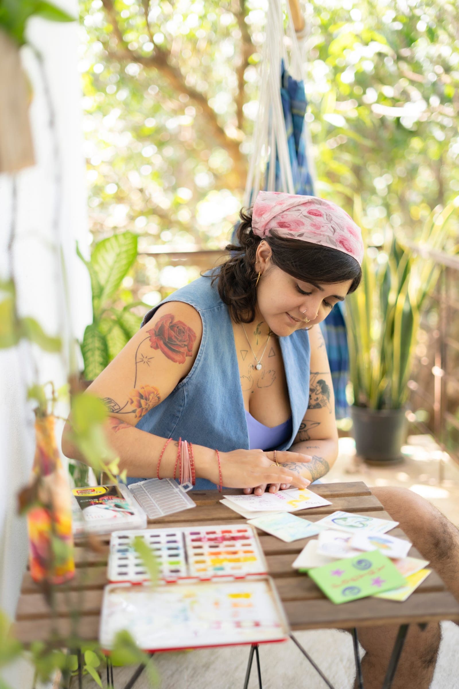 Hansika painting watercolors in her outdoor studio